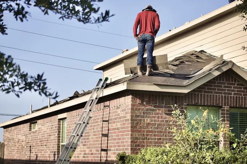 Professional roofer working on a residential roof in Lutherville Timonium